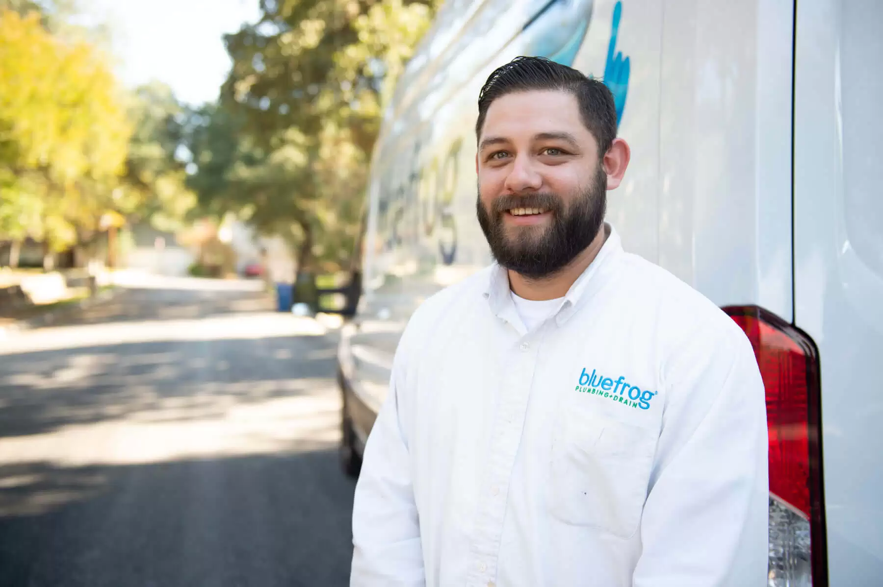 Bluefrog Plumber in front of a van