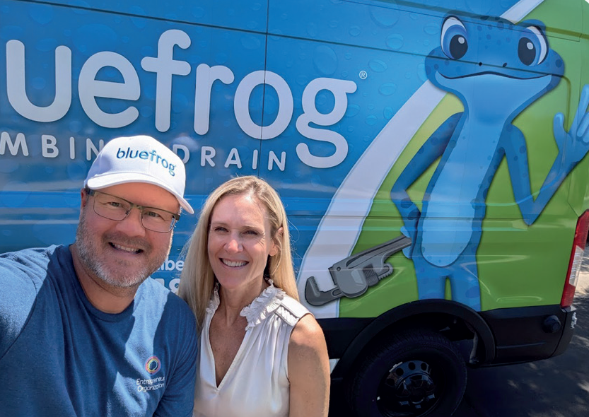 Bluefrog technician walking up driveway